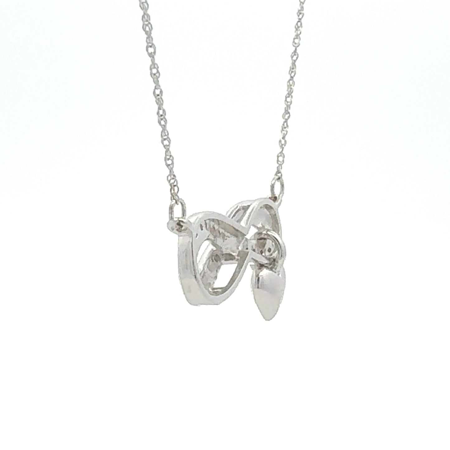 Colgante religioso de cruz con diamante de .04ct de plata de ley