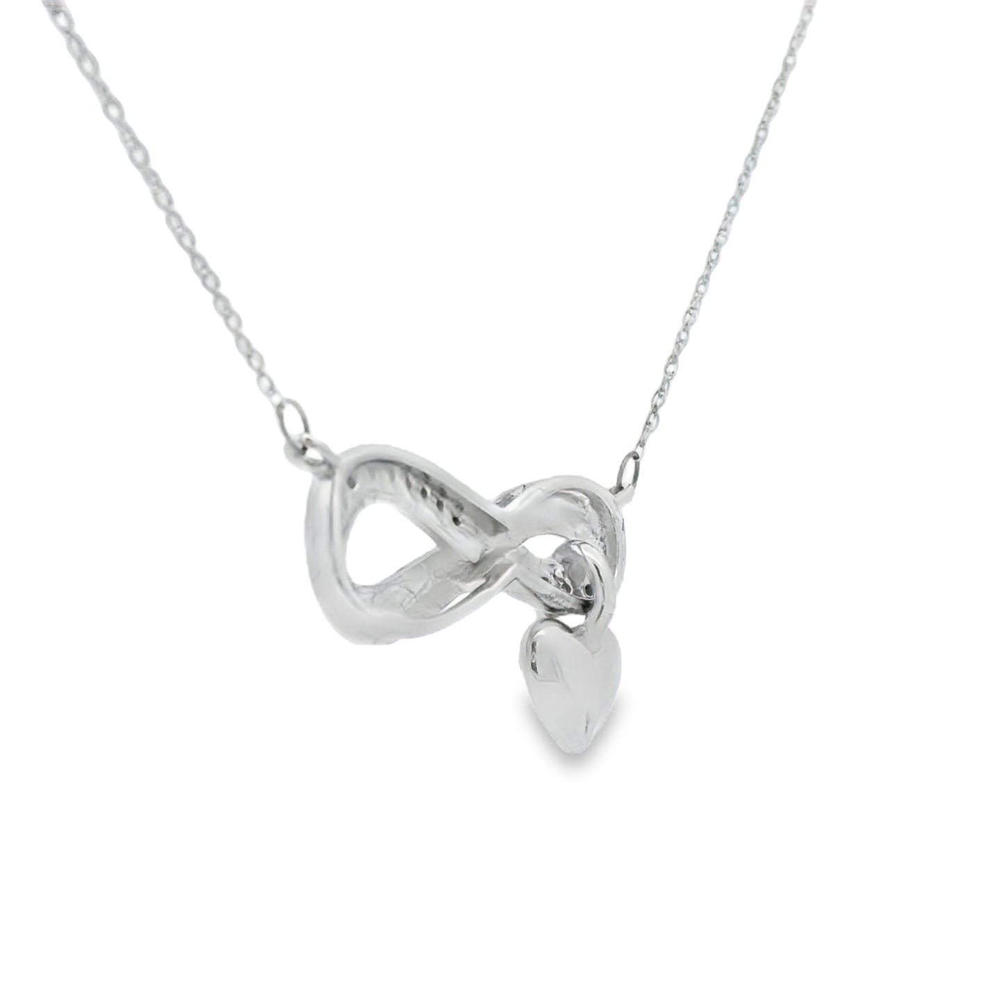 Colgante religioso de cruz con diamante de .04ct de plata de ley