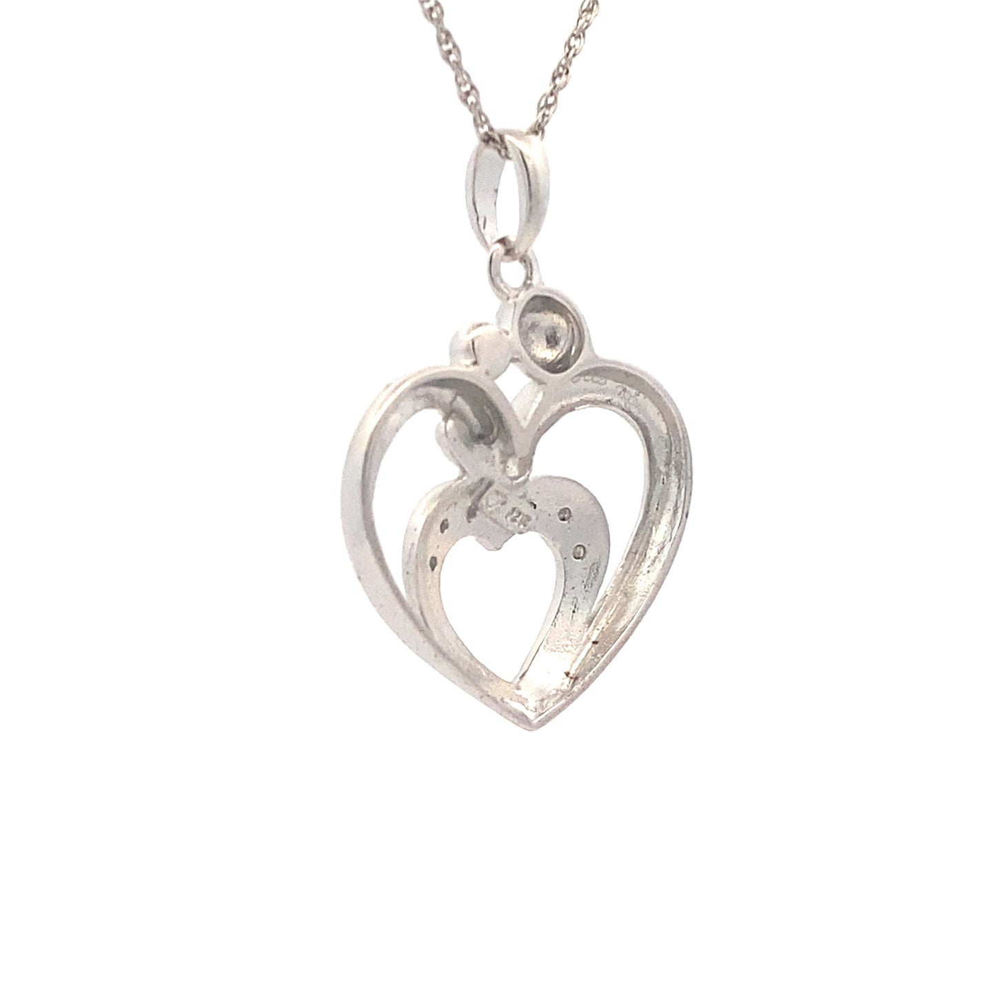 Colgante de corazón de diamantes de .10 ct y plata de ley