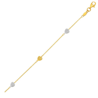 Tobillera de oro bicolor amarillo y blanco de 14k con corazones texturizados