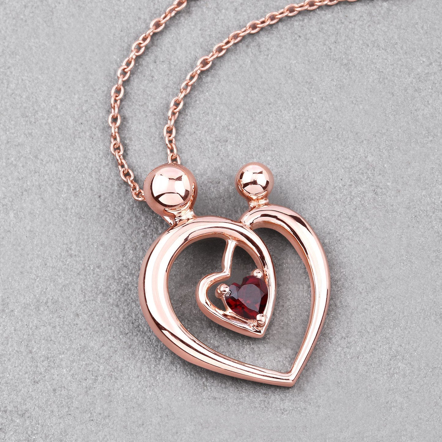 Colgante de plata de ley .925 con granate genuino de 0,32 quilates