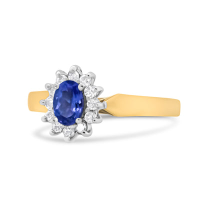 Anillo de Halo de Oro Amarillo de 14K con Diamantes Redondos de 1/5 Cttw y Tanzanita Azul Ovalada de 6x4mm (Color H-I, Claridad I1-I2) - Talla 7.75