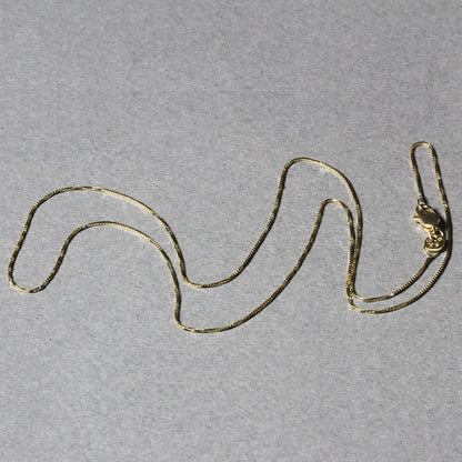 Cadena clásica de oro amarillo de 14k y 0.6mm
