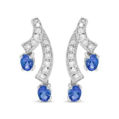 Pendientes de gota de oro blanco de 14 quilates con tanzanita azul natural ovalada de 4x3MM y diamantes de 1/5 Cttw con doble caída de 3/4" (Color H-I, Claridad VS1-VS2)