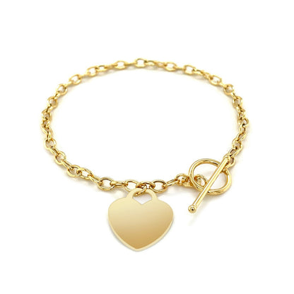 Pulsera de eslabones con cierre de palanca y dije de corazón en oro amarillo de 14k