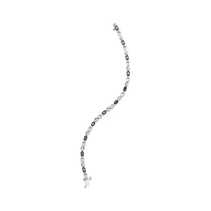Pulsera de eslabones en "X" de oro blanco de 10K con zafiro ovalado de 5x4mm y diamantes de 1/10 Cttw engarzados en garra - Talla 7" (Color H-I, Claridad SI1-SI2)