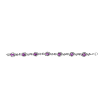 Pulsera de tenis con cruz de amatista ovalada de 7x5 mm y diamante natural redondo de 1/10 Cttw de plata de ley .925 (color I-J, claridad I1-I2) - 7"