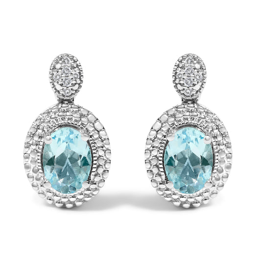 Pendientes con acento de diamante de plata de ley .925 y topacio azul ovalado con halo de cuentas (color I-J, claridad I1-I2)