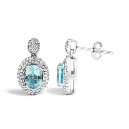 Pendientes con acento de diamante de plata de ley .925 y topacio azul ovalado con halo de cuentas (color I-J, claridad I1-I2)