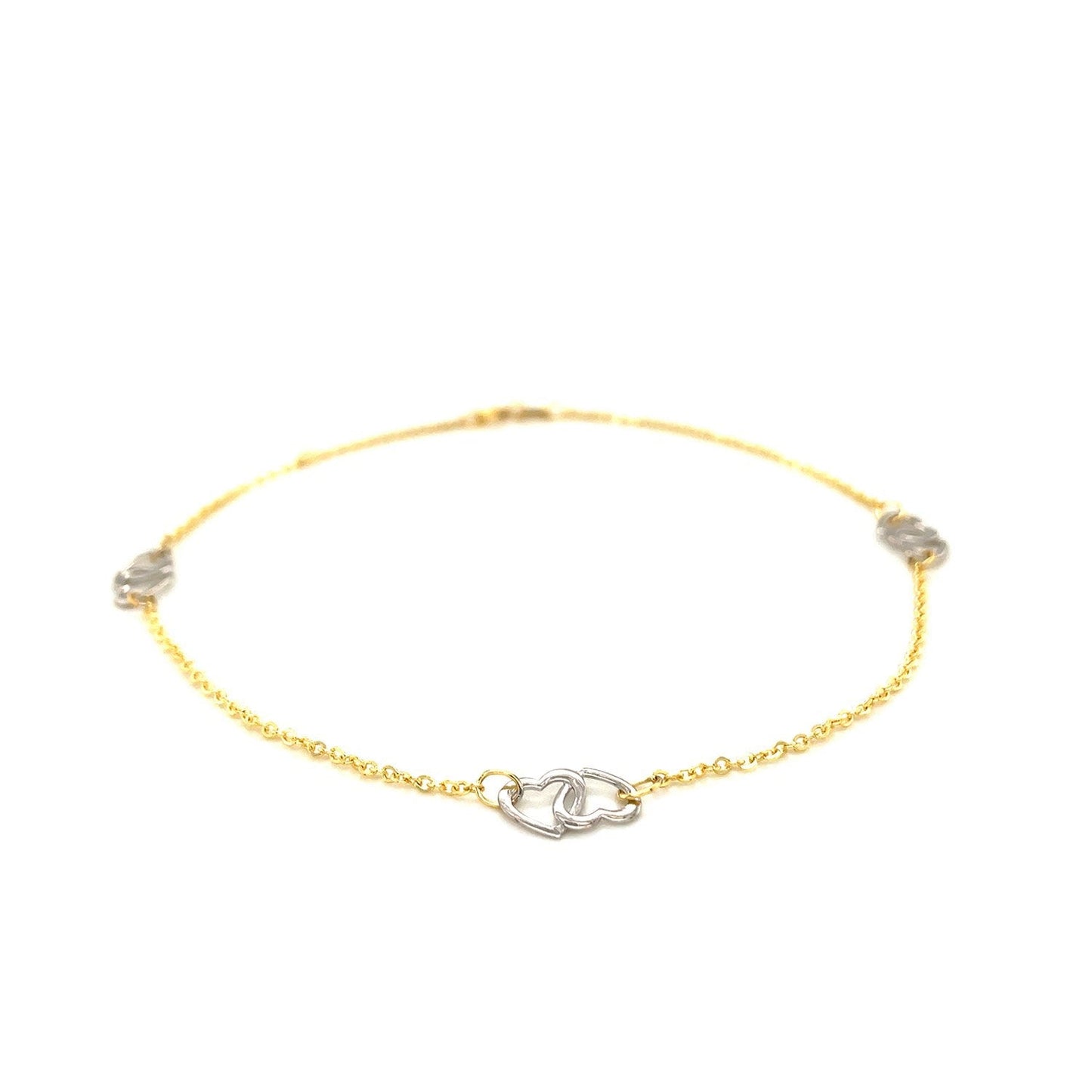 Tobillera con diseño de corazón entrelazado en oro bicolor de 14k