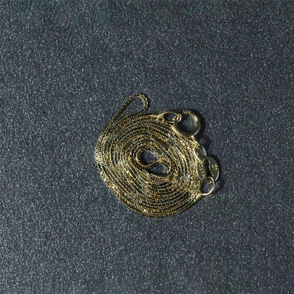 Cadena clásica de oro amarillo de 14k y 0.6mm
