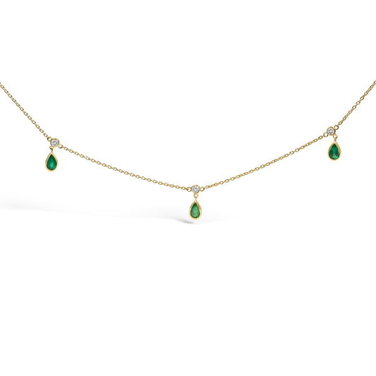 Collar de oro amarillo de 10K con esmeralda verde de 5x3 mm y estación de diamantes colgantes - 18 pulgadas