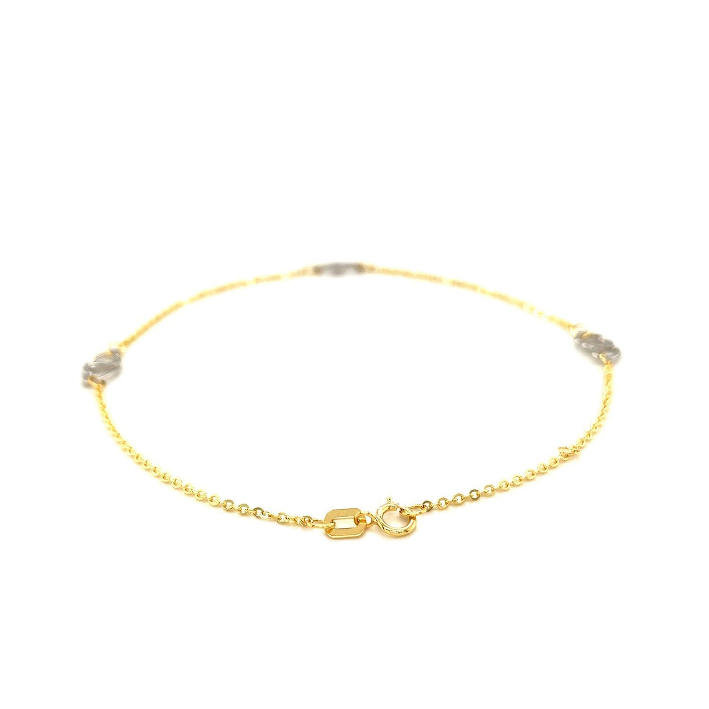 Tobillera con diseño de corazón entrelazado en oro bicolor de 14k