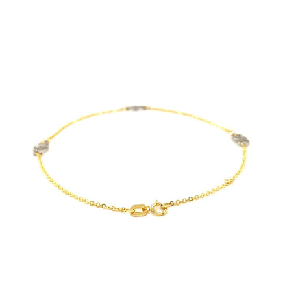 Tobillera con diseño de corazón entrelazado en oro bicolor de 14k