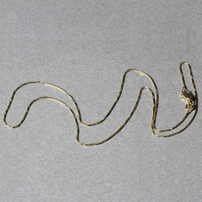 Cadena clásica de oro amarillo de 14k y 0.6mm