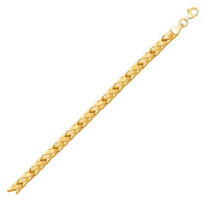 Pulsera de línea en oro amarillo de 14k con diseño de cesta elegante