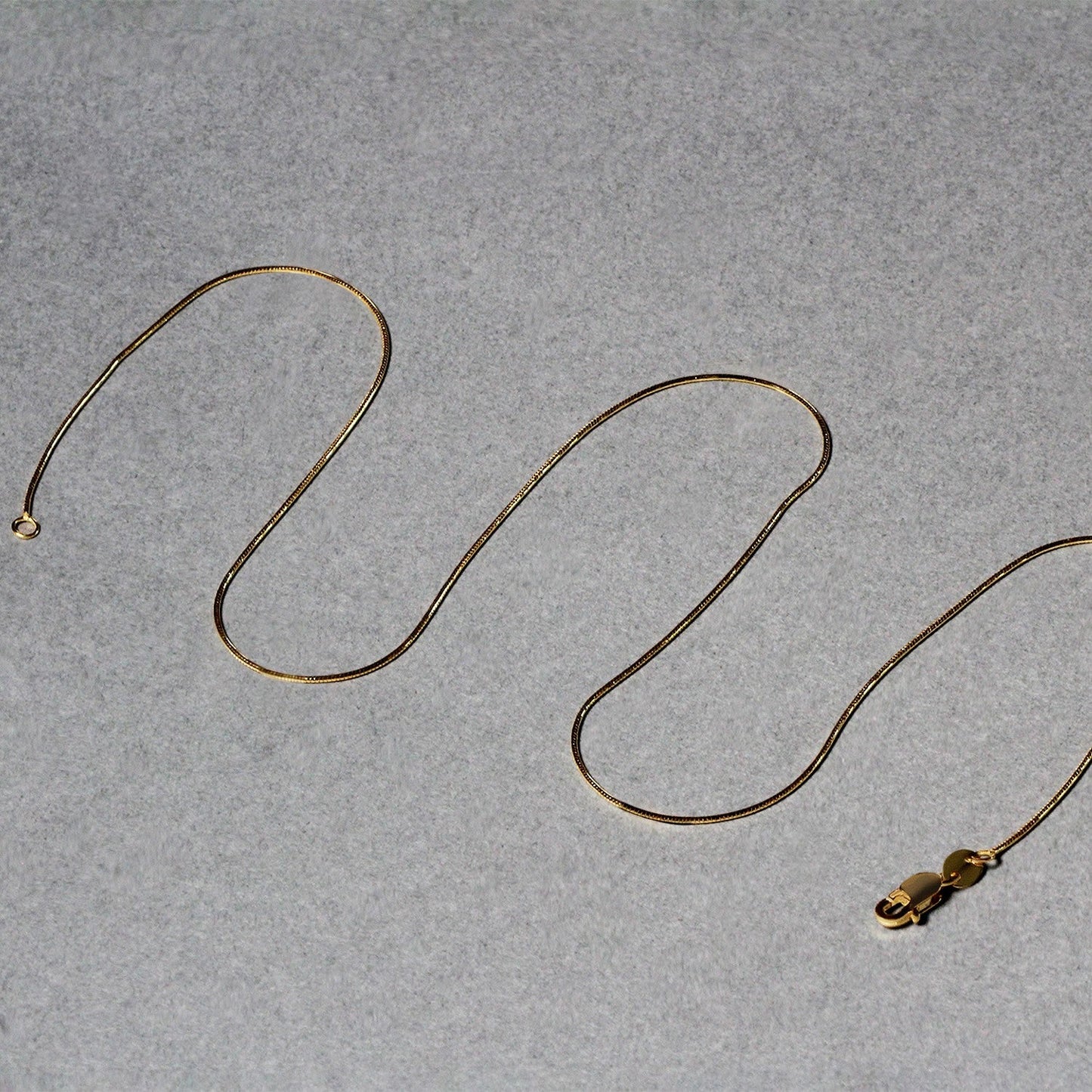 Cadena redonda de serpiente de oro amarillo de 14k de 0.7mm