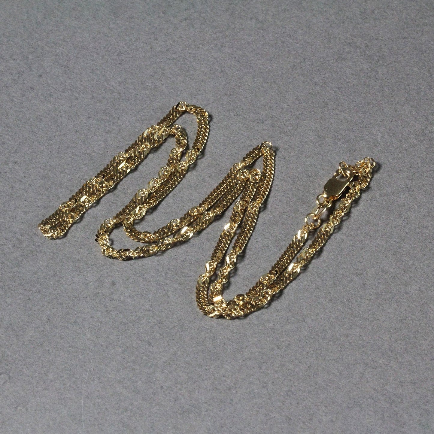 Cadena Singapur de oro amarillo de 14k y 2.1mm