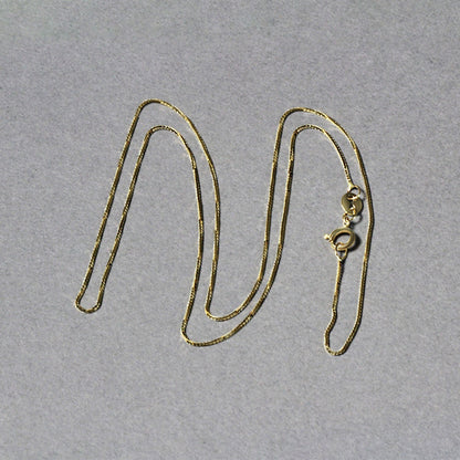 Cadena clásica de oro amarillo de 14k y 0.6mm