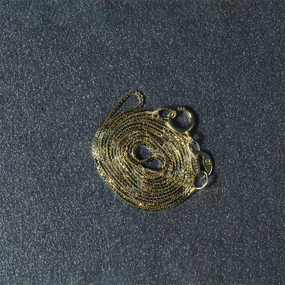 Cadena clásica de oro amarillo de 14k y 0.6mm