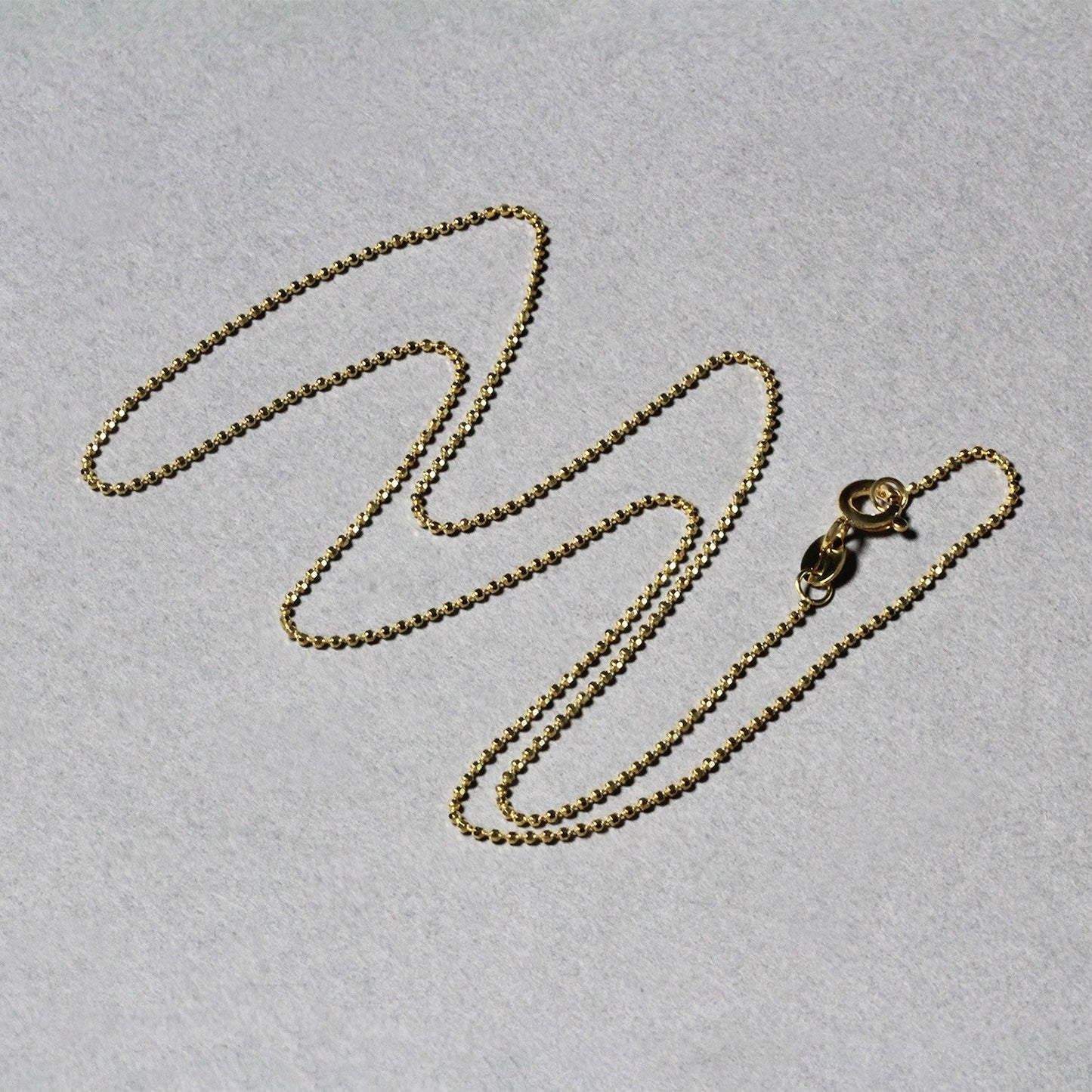 Cadena de oro amarillo de 14k de 1.0mm con cuentas facetadas