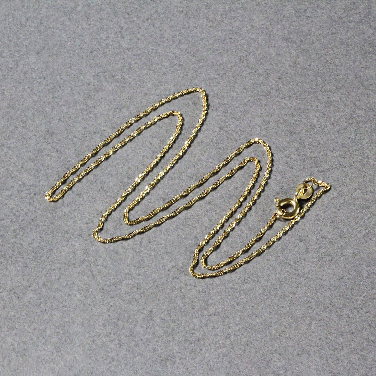 Cadena Singapur de oro amarillo de 14k y 1,0 mm