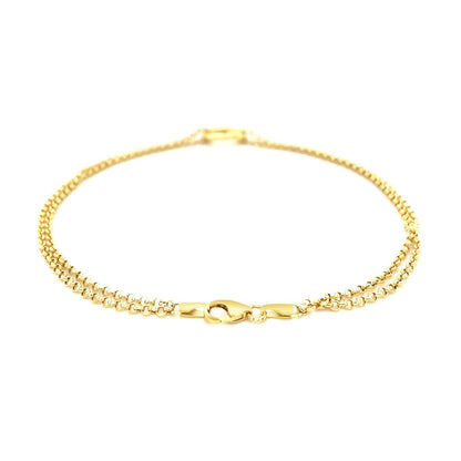 Tobillera de cadena rolo doble de oro amarillo de 14k con estación de corazón abierto