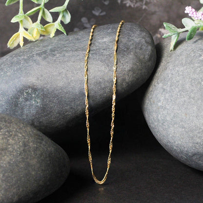 Cadena Singapur de oro amarillo de 14k y 1.5mm