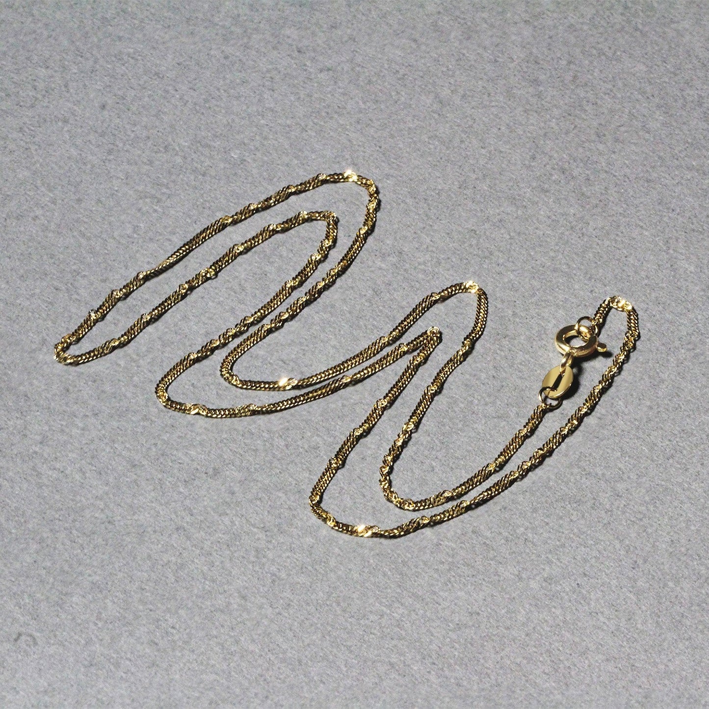 Cadena Singapur de oro amarillo de 14k y 1.5mm
