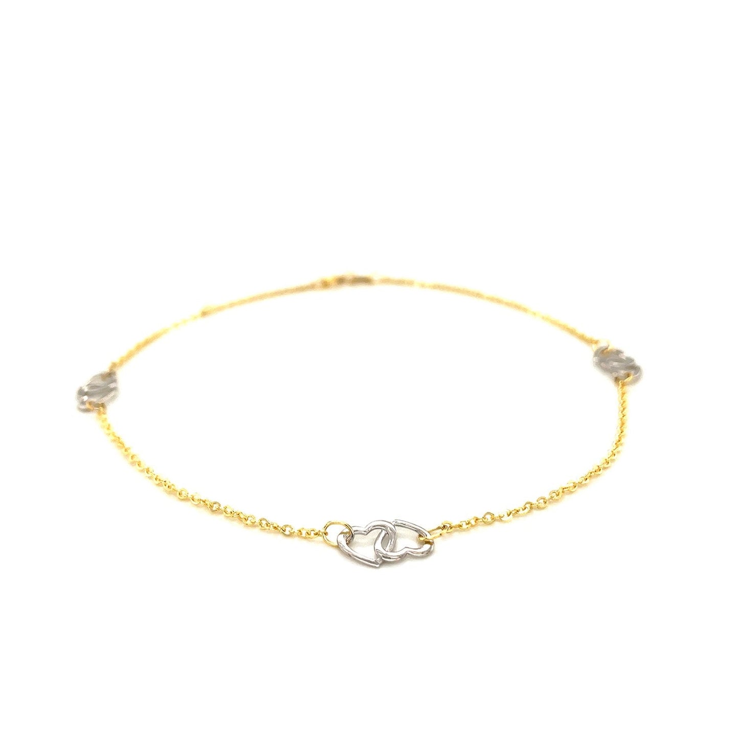 Tobillera con diseño de corazón entrelazado en oro bicolor de 14k