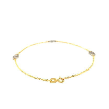 Tobillera con diseño de corazón entrelazado en oro bicolor de 14k