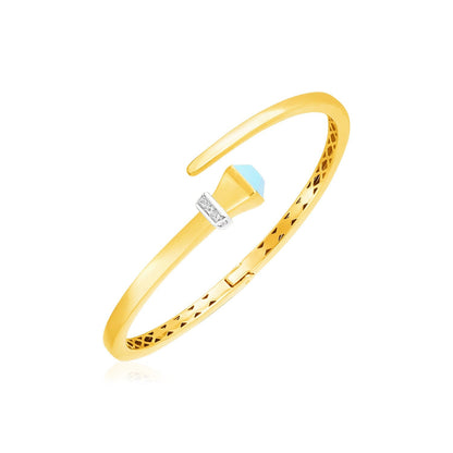 Brazalete rígido articulado de oro amarillo de 14k estilo cruzado con turquesa y diamantes