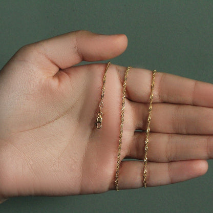 Cadena Singapur de oro amarillo de 14k y 1,7 mm