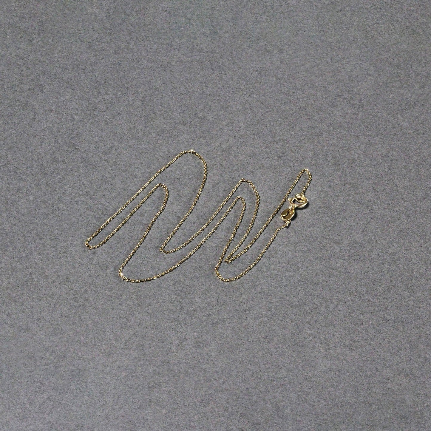 Cadena de eslabones tipo cable con corte de diamante de oro amarillo de 14k y 0,7 mm