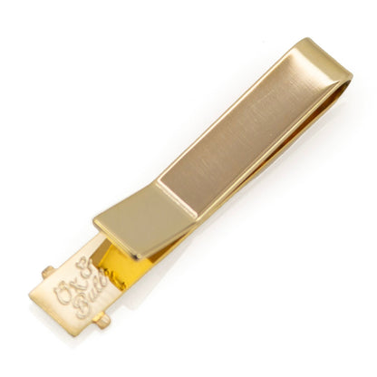 Pasador de corbata dorado con cruz