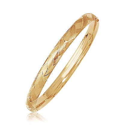 Brazalete abombado de oro amarillo de 14k con motivo trenzado