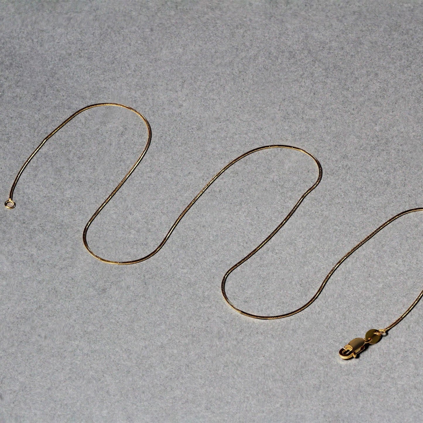 Cadena redonda de serpiente de oro amarillo de 14k de 0.7mm