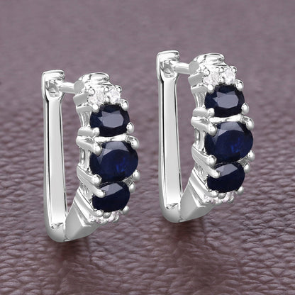 Pendientes de plata de ley .925 con zafiro azul genuino de 1,66 quilates y topacio blanco