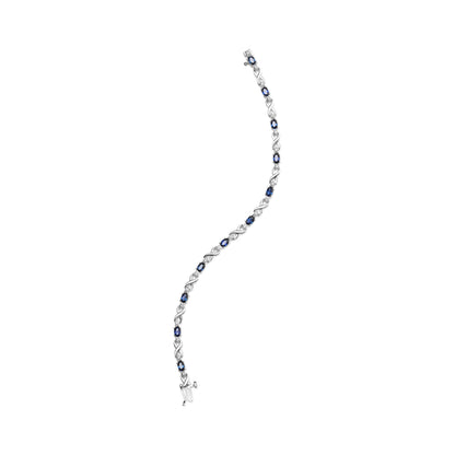Pulsera de eslabones en "X" de oro blanco de 10K con zafiro ovalado de 5x4mm y diamantes de 1/10 Cttw engarzados en garra - Talla 7" (Color H-I, Claridad SI1-SI2)