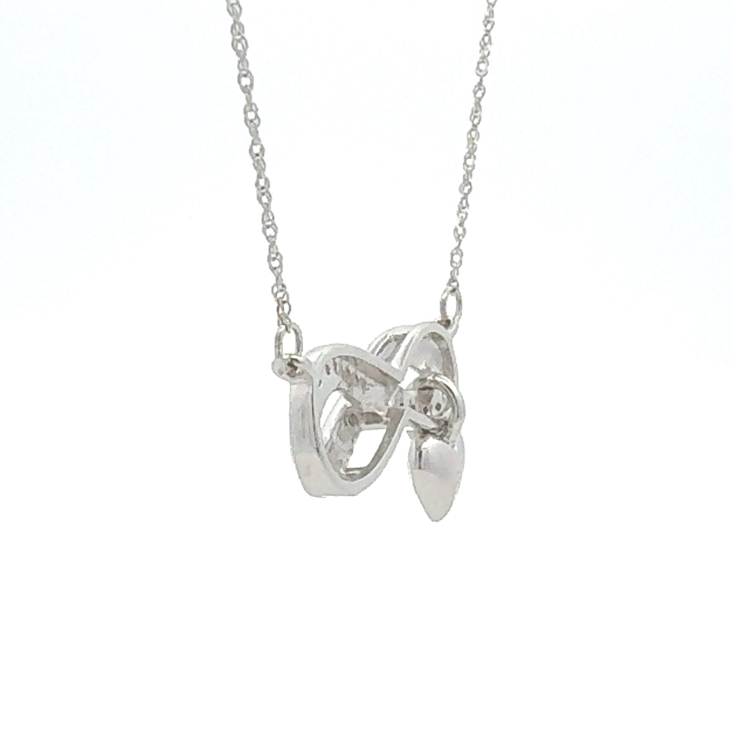 Colgante religioso de cruz con diamante de .04ct de plata de ley