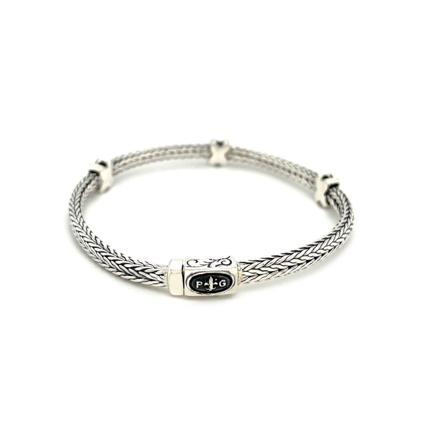 Pulsera de cuerda trenzada con detalles de zafiro negro en plata esterlina