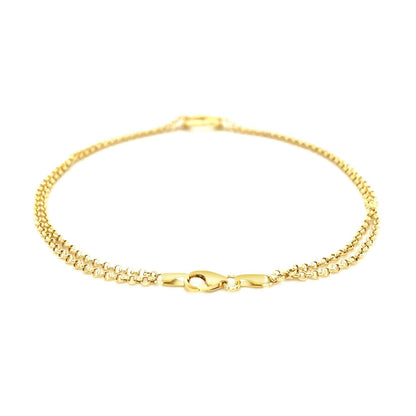 Tobillera de cadena rolo doble de oro amarillo de 14k con estación de corazón abierto