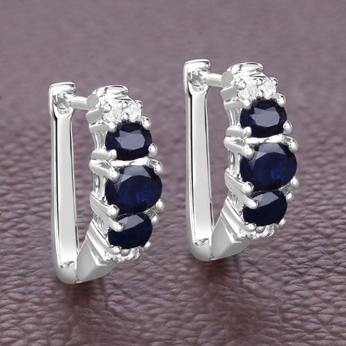 Pendientes de plata de ley .925 con zafiro azul genuino de 1,66 quilates y topacio blanco