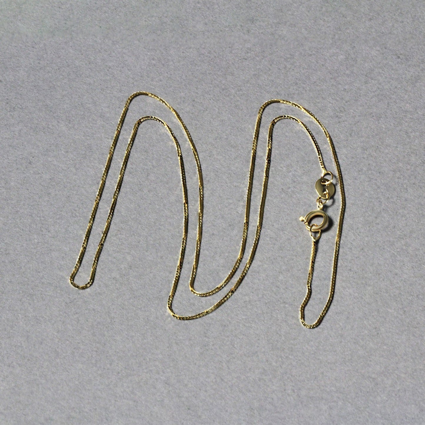 Cadena clásica de oro amarillo de 14k y 0.6mm