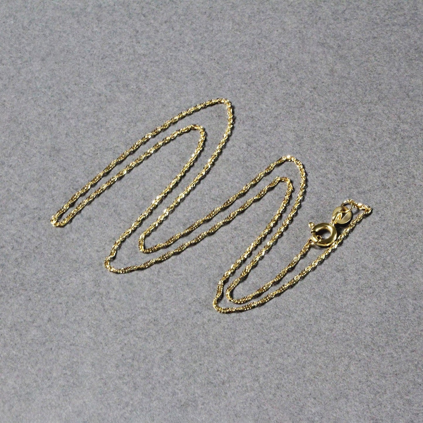 Cadena Singapur de oro amarillo de 14k y 1,0 mm