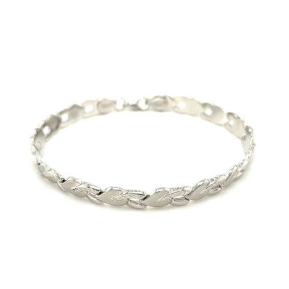 Pulsera de oro blanco de 14k con forma de corazón texturizado