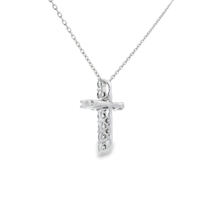 Colgante religioso de cruz con diamante de .35ct en oro blanco de 14K