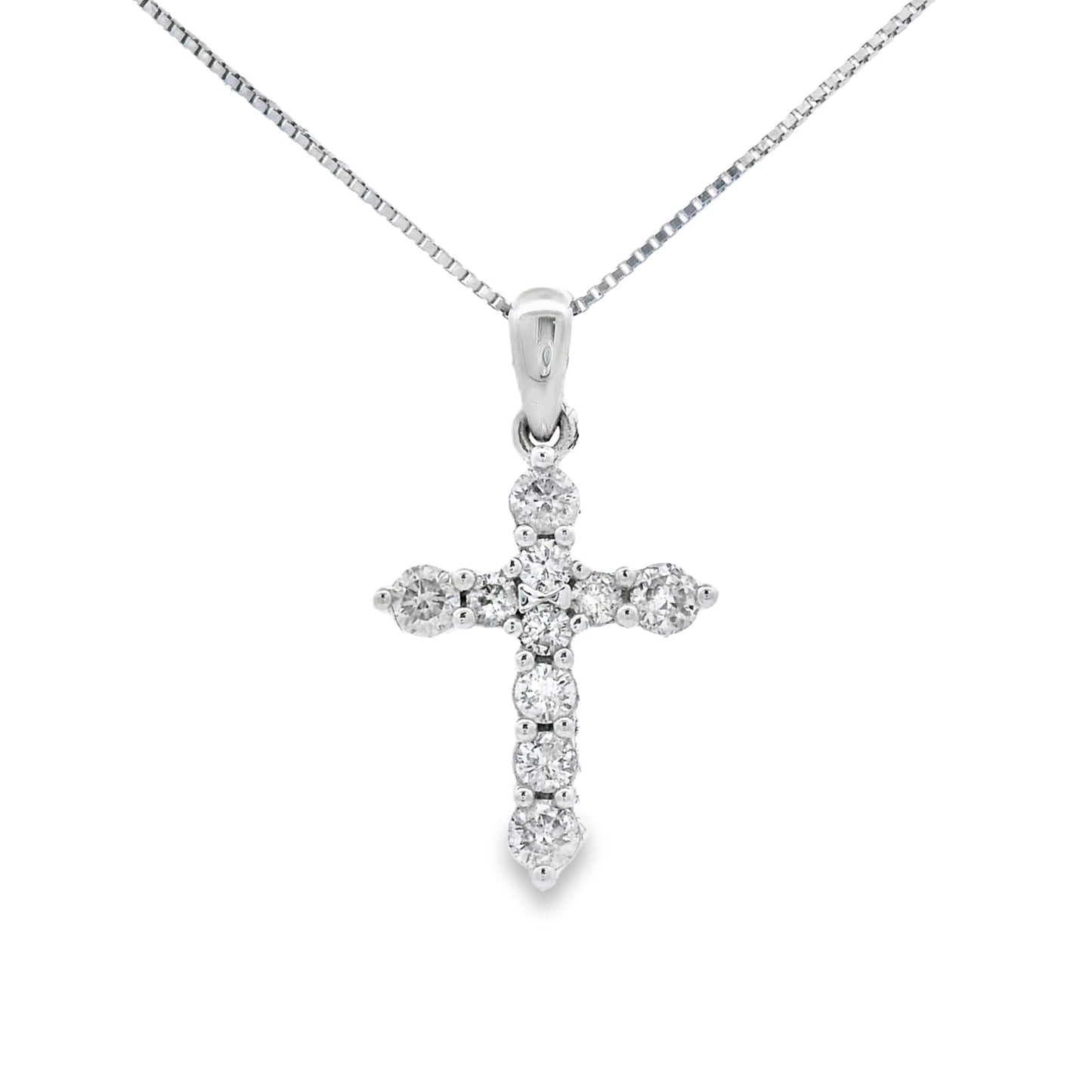 Colgante religioso de cruz con diamante de 0,30 qt en oro blanco de 14 kt