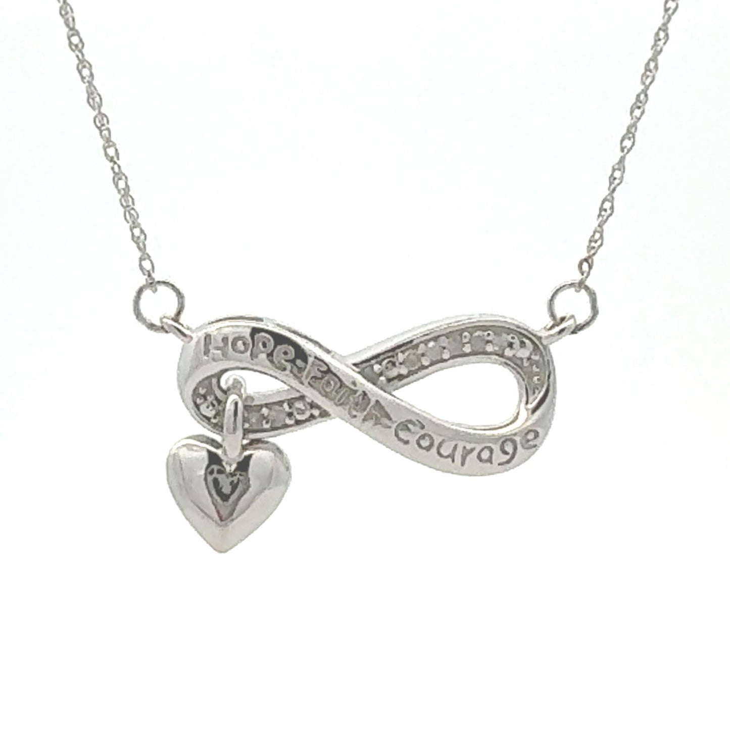 Colgante religioso de cruz con diamante de .04ct de plata de ley