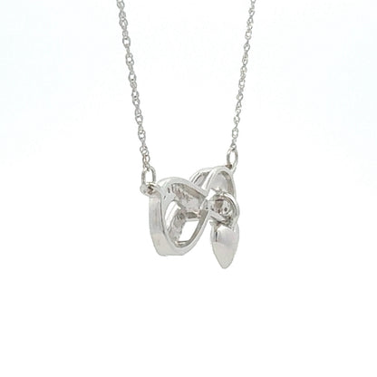 Colgante religioso de cruz con diamante de .04ct de plata de ley